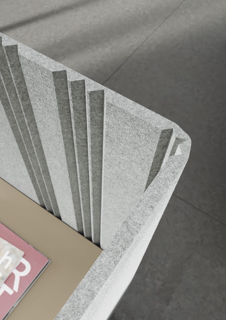 Ecran acoustique en feutre PET qui entoure le bureau. Vu de dessus au niveau de l'angle du bureau.