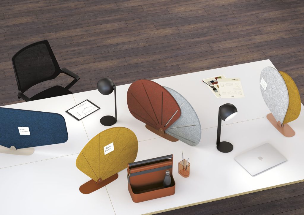 4 Butterfly acoustic screens made of colored PET felt on a workstation. Top view.