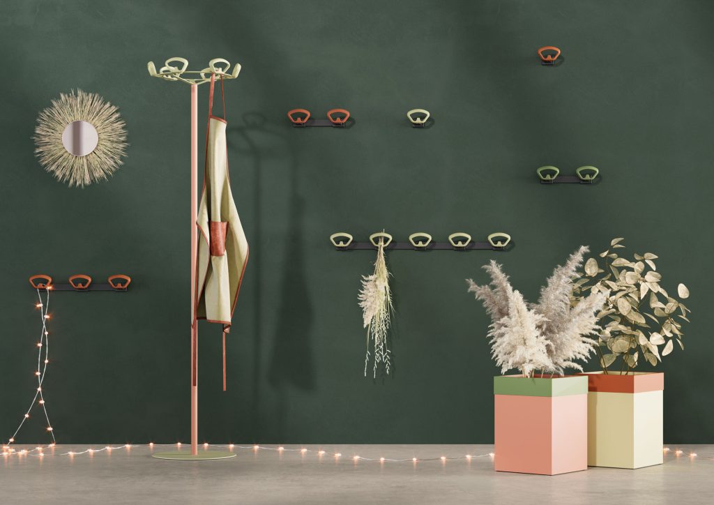 Image featuring a green and pink coat rack with umbrella and a set of wall-mounted coat racks in various sizes and colors.