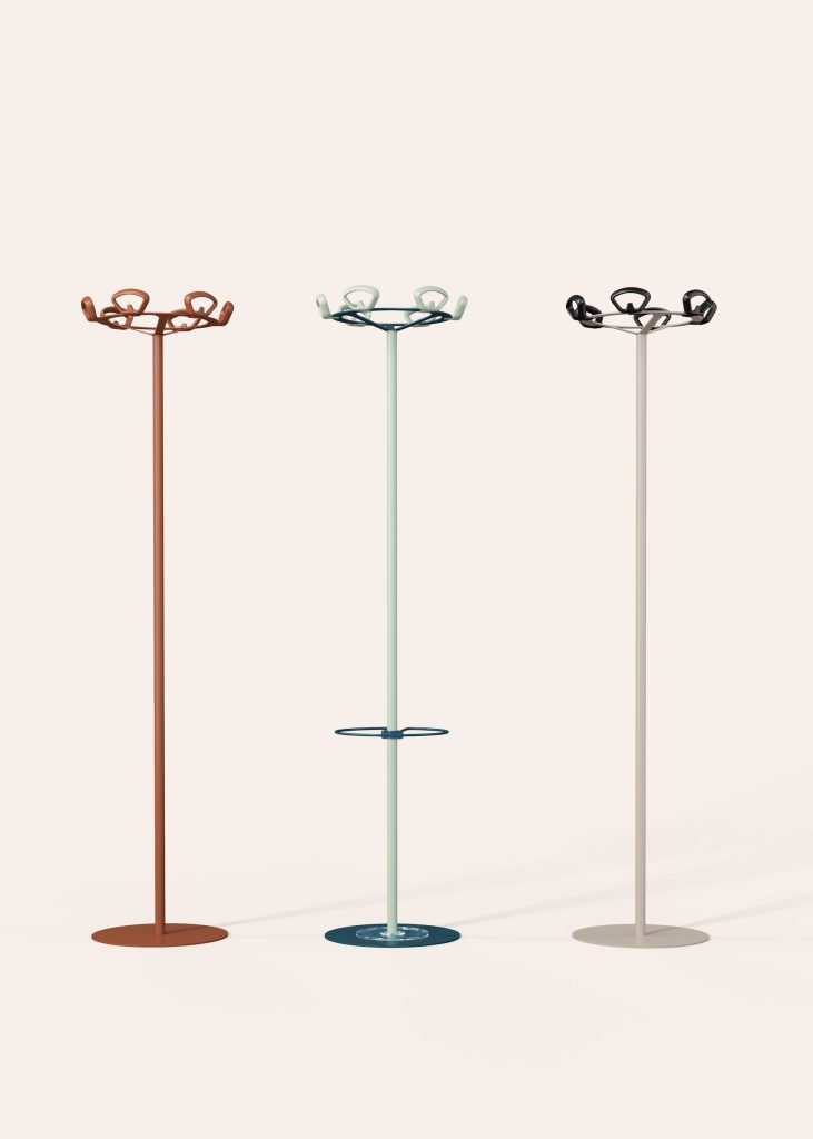 Cyclo image showing 3 coat racks in different colors.