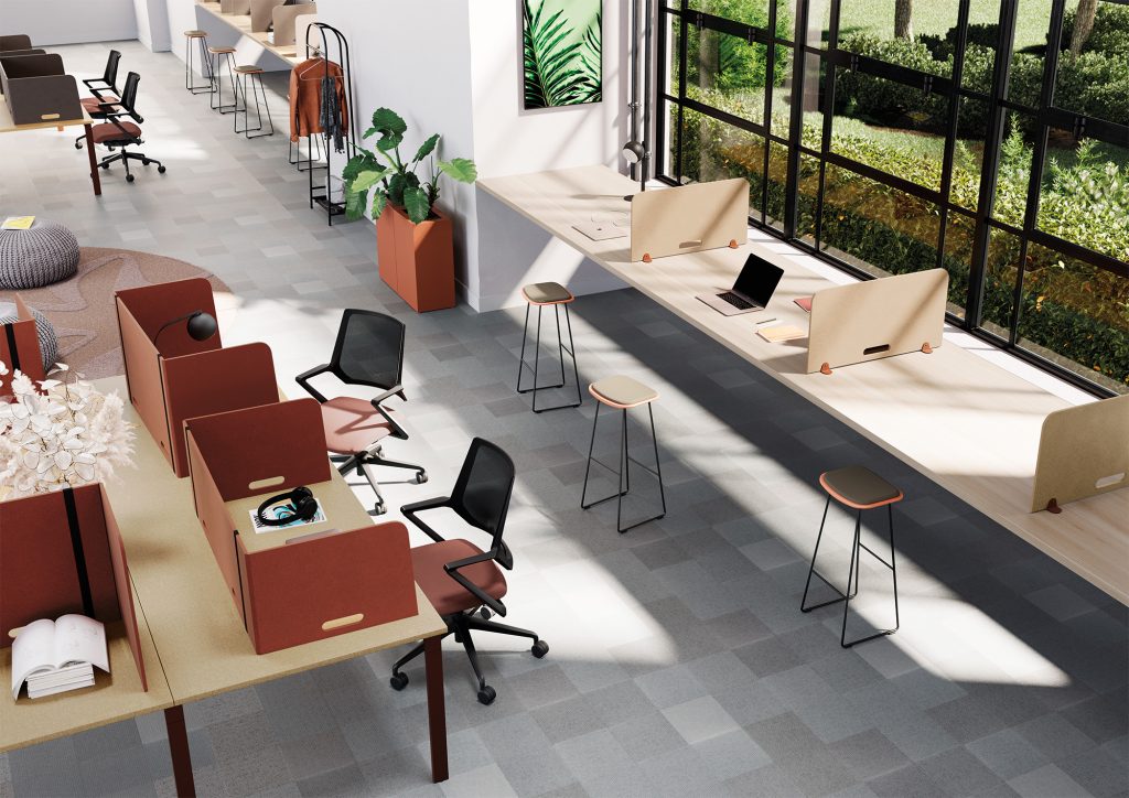 Bright, shared workspace. Work surfaces are separated by colorful, modular, and movable PET felt acoustic screens.