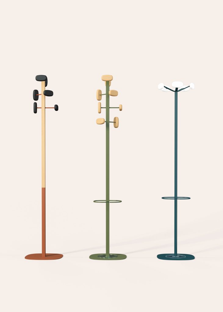 Cyclo image showing 3 colored coat racks made of powder-coated wood and steel.