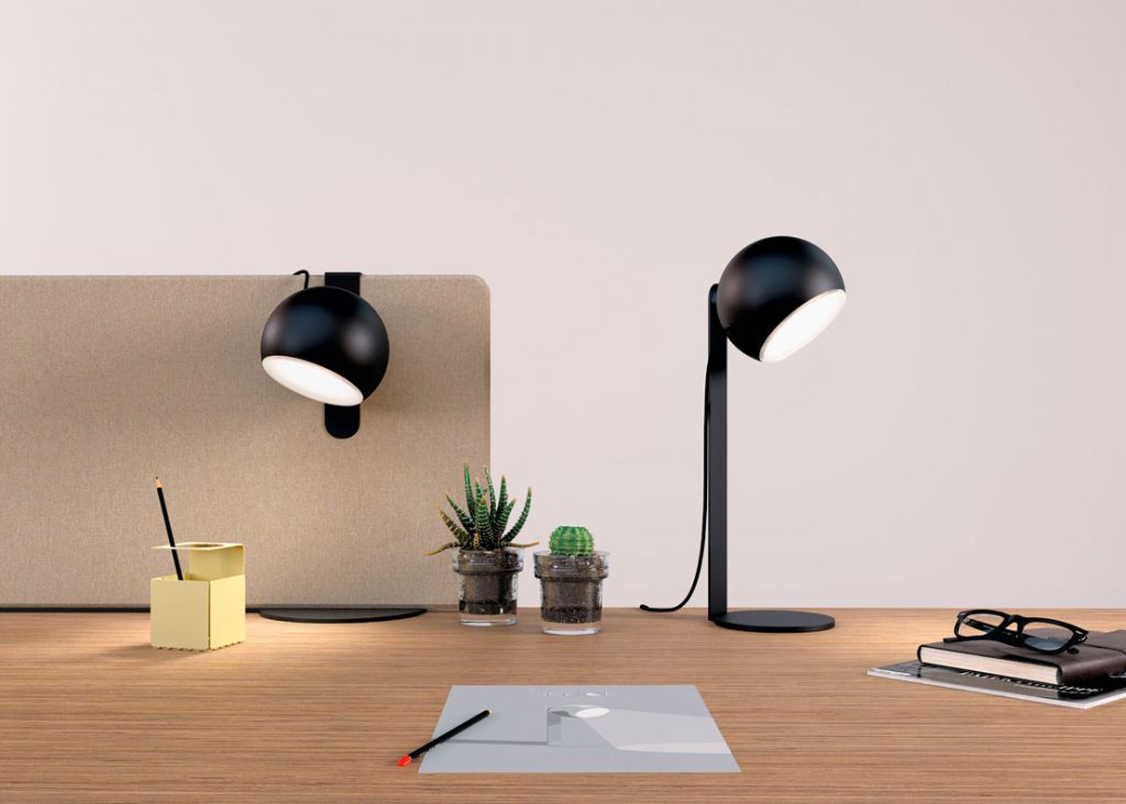 Black Scoop lamp, one on a stand, the other on a screen