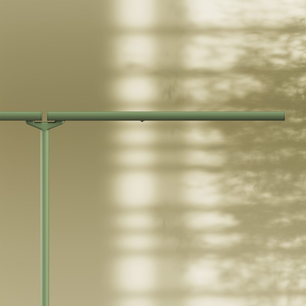 Focus on a designer floor lamp with two heads in botanical green.